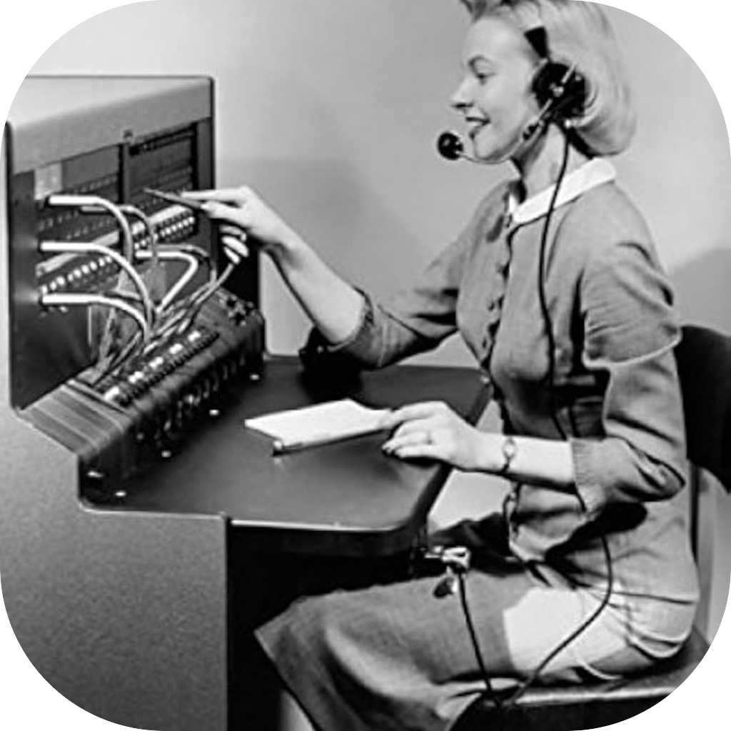 Black-and-white photo of a switchboard operator wearing a headset.